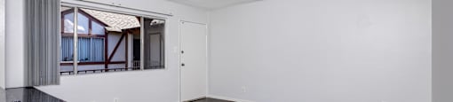 A room with a window and a counter.