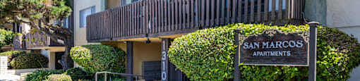 the sign apartments in front of the building