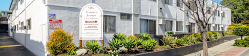 a large white building with a sign in front of it