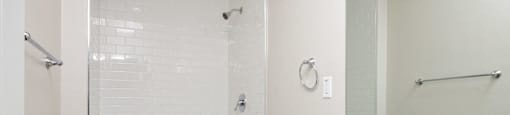 a bathroom with a sink and a shower and a toilet