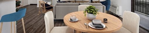 A modern dining room with a wooden table and chairs.