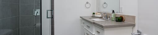 a bathroom with a sink and a shower