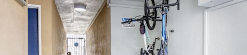 a hallway with bikes hanging on the wall