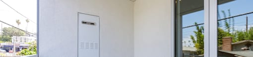 the entrance to a balcony with a sliding glass door