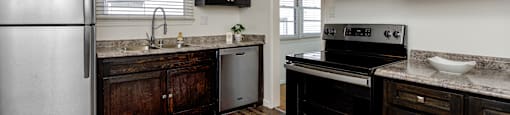 a kitchen with stainless steel appliances and wooden cabinets