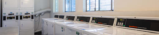 the laundry room is equipped with washers and dryers