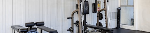 a home gym with weights and cardio equipment