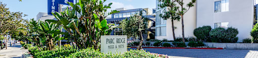 the building in which the hotel is located is a large white building with a sign