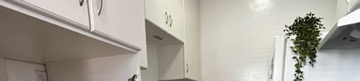 Kitchen with a washer and dryer in it