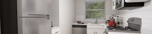 a kitchen with white cabinets and stainless steel appliances