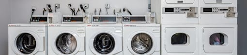 a row of washing machines sitting next to each other