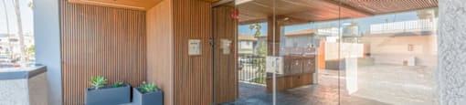 the lobby or reception area of a building with glass doors