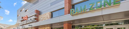 A Ram Zone storefront with a bicycle parked outside.
