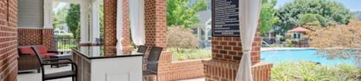 A patio with a white table and chairs is shown.