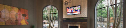 a living room with a couch and chairs and a television