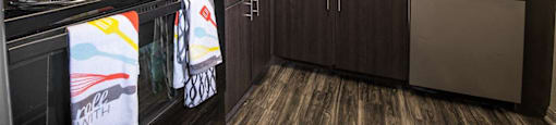 a kitchen with a stove microwave and sink