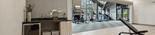 a gym with a desk and a chair in the middle of a room