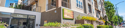 Apartments for Rent in Walnut Creek, CA - Ivy Hill - Building Exterior with Tan and White Details, Landscaping, and Street View