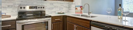 Apartments for Rent in Walnut Creek, CA- Ivy Hill- Kitchen with Stainless-Steel Appliances, Wood-Style Cabinetry, and Quartz Countertops
