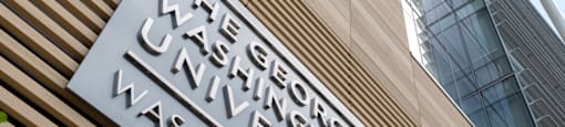 The sign of The George Washington University is displayed on a building.  at The 925 Apartments, Washington, DC