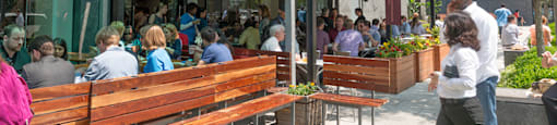 A restaurant named Sweet green with people sitting outside.  at The 925 Apartments, Washington, DC