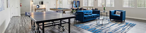 the preserve at ballantyne commons clubhouse with table tennis and couches