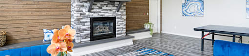 a living room with a fireplace and a television