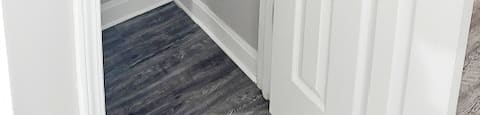 A white door with a silver handle and a white interior.