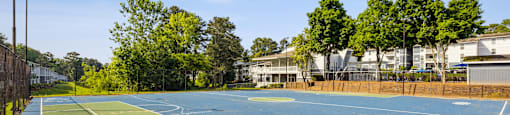 the tennis courts at the whispering winds apartments in pearland tx