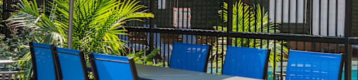 a table and chairs with an umbrella on a patio