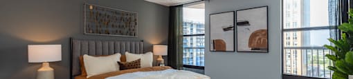 a bedroom with a large bed and a window