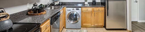 a kitchen with stainless steel appliances and wooden cabinets