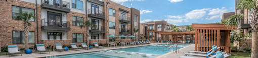 pool area with chairs at soneto on western apartments