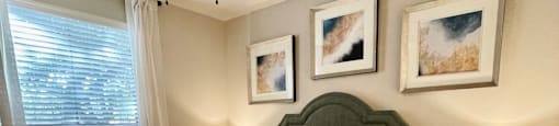 a bedroom with a bed and a ceiling fan