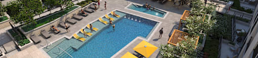 A pool area with a yellow sunbed and a yellow umbrella.