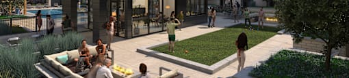 A group of people are sitting on a couch in a courtyard.