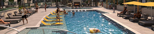 A large swimming pool in a courtyard surrounded by buildings.