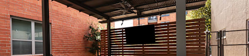 an outdoor bar with chairs in a patio at The Can Plant Residences at Pearl, San Antonio, TX, 78215