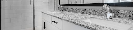 a bathroom with a sink and a shower