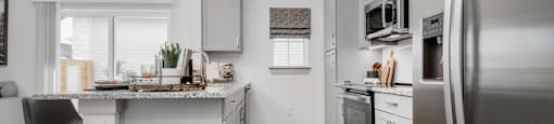 a kitchen with stainless steel appliances and a counter top