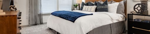 the preserve at ballantyne commons bedroom with large bed and windows