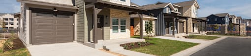new homes on the corner of a street in a subdivision