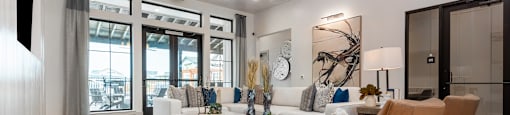 the preserve at ballantyne commons living room with white couches and chairs