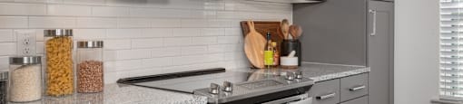 a modern kitchen with stainless steel appliances and granite counter tops