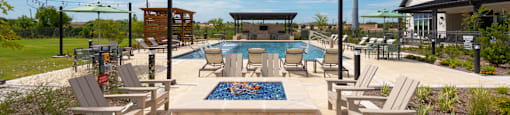 A pool area with chairs and a pool table.