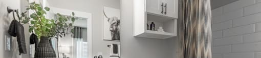 A bathroom with a white toilet and a white sink.