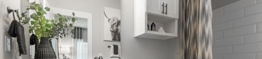 A bathroom with a white toilet and a white sink.