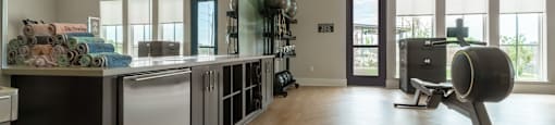 A modern kitchen with a large island and stainless steel appliances.