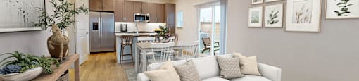 a living room with a couch and a table in a kitchen