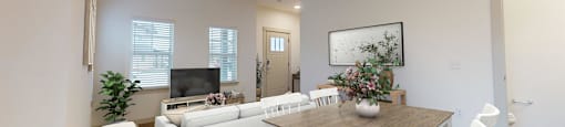 a living room and dining room with white furniture and a table